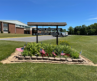 Outside view of Dassa McKinney Elementary School building and sign